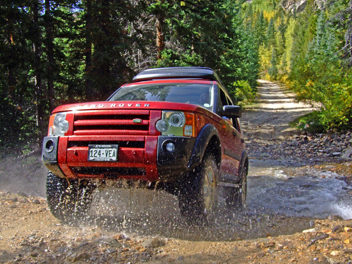 Land Rover off-road at creek crossing
