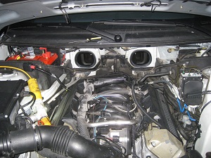Engine bay overview showing coolant leak area